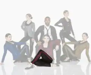 Six dancers pose in sparkling costumes against white background.