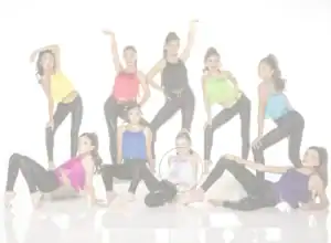 Young dancers posing in colorful fringe tops and black leggings
