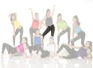 Young dancers posing in colorful fringe tops and black leggings