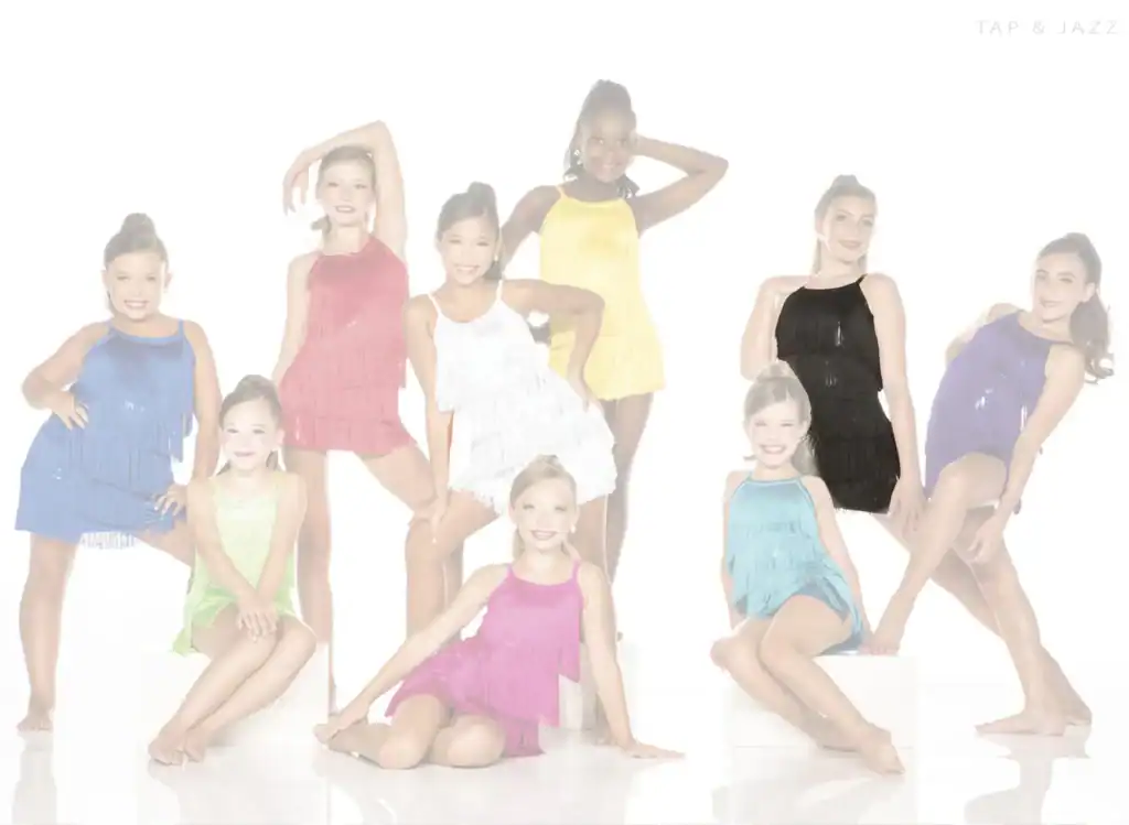 Young dancers posing in colorful fringe costumes