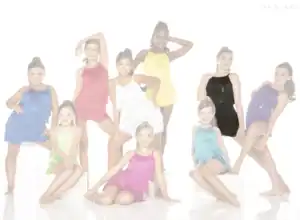 Young dancers posing in colorful fringe costumes