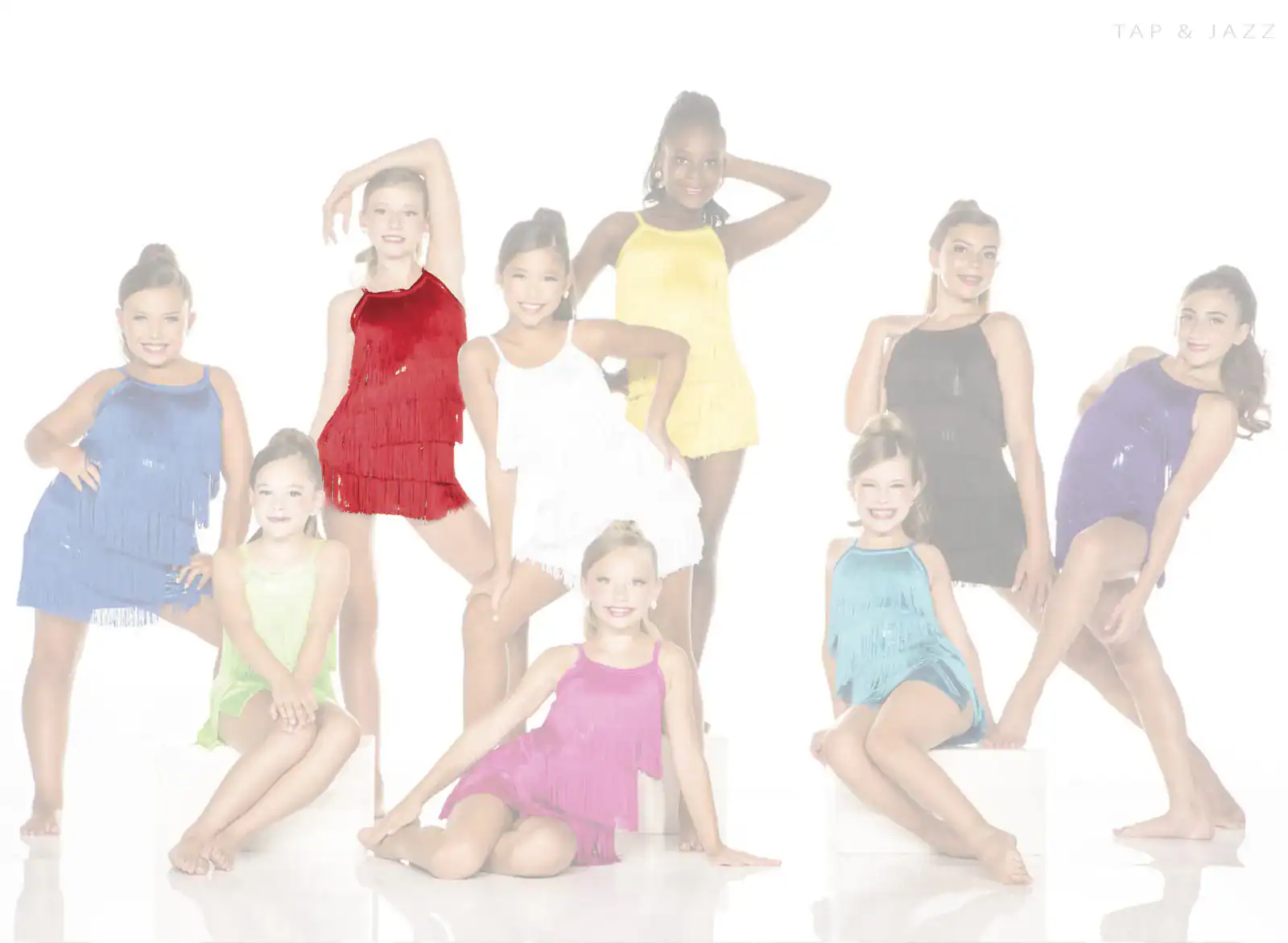 Young dancers pose in colorful fringe costumes.