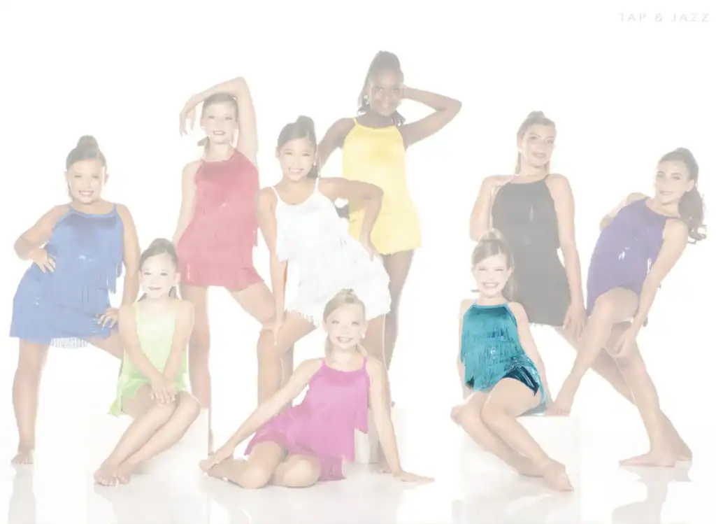 Young dancers posing in colorful fringe costumes