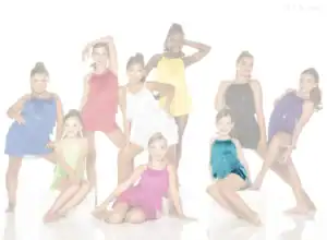 Young dancers posing in colorful fringe costumes