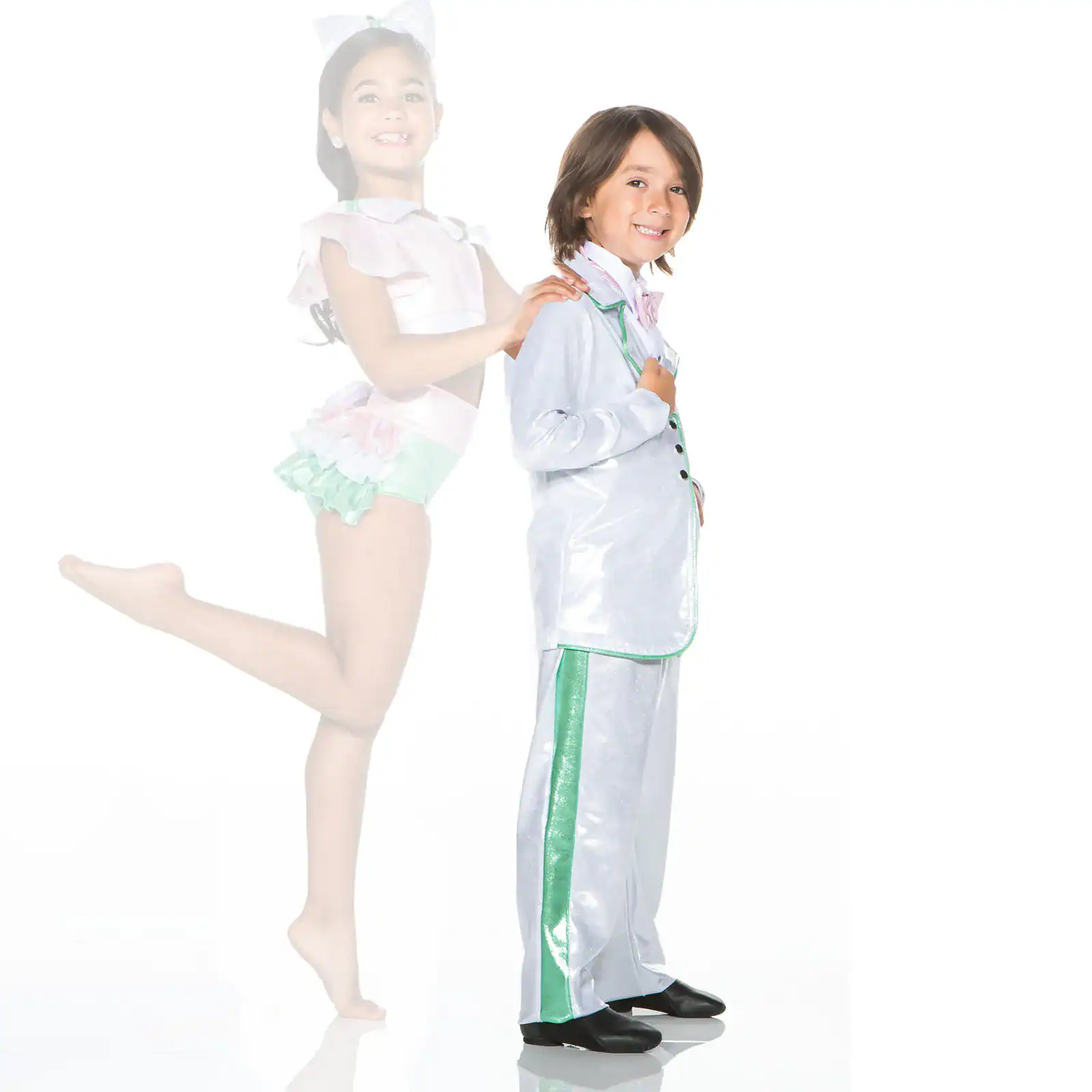 Young dancers in shiny costumes posing against white background