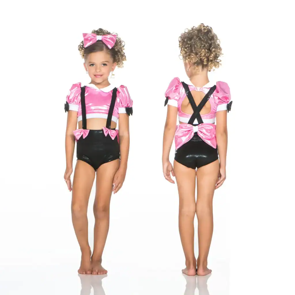 Girl modeling pink and black dance costume, front and back