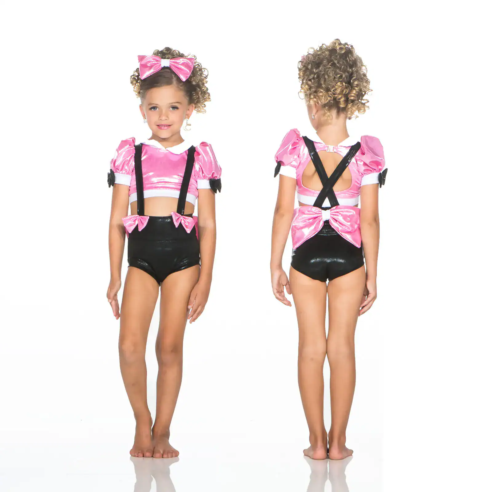 Girl modeling pink and black dance costume, front and back
