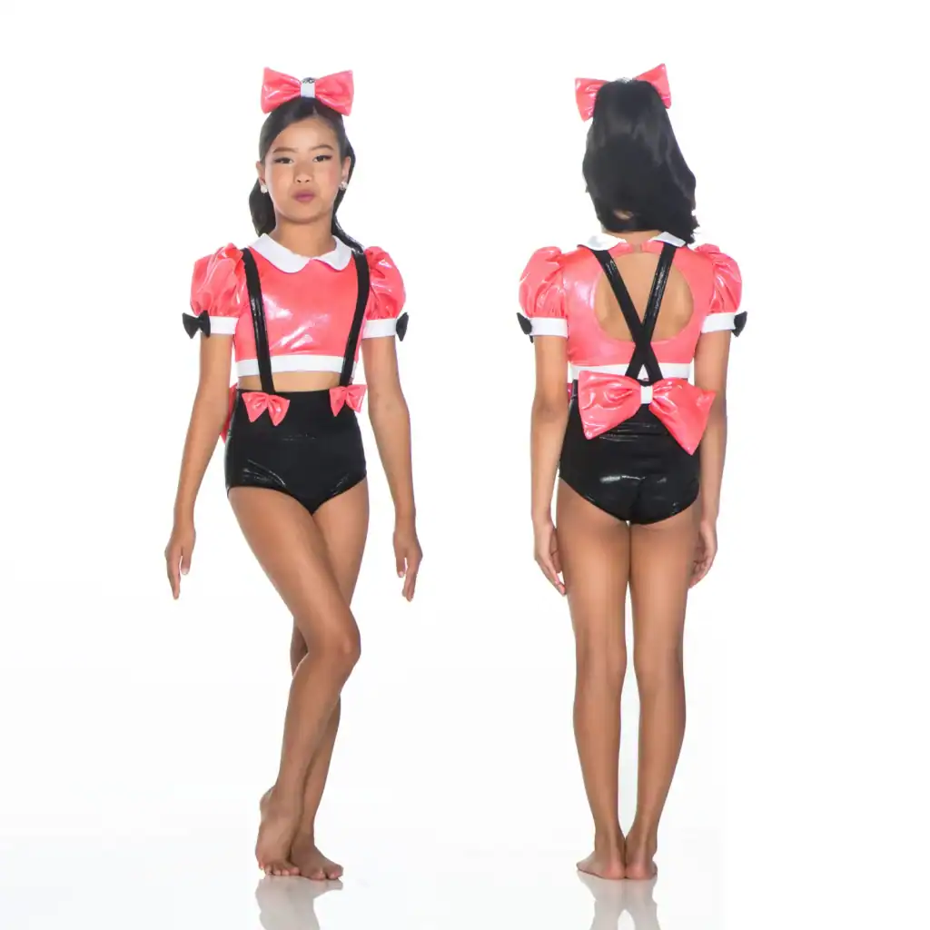 Girl modeling pink and black bow-accented dance costume