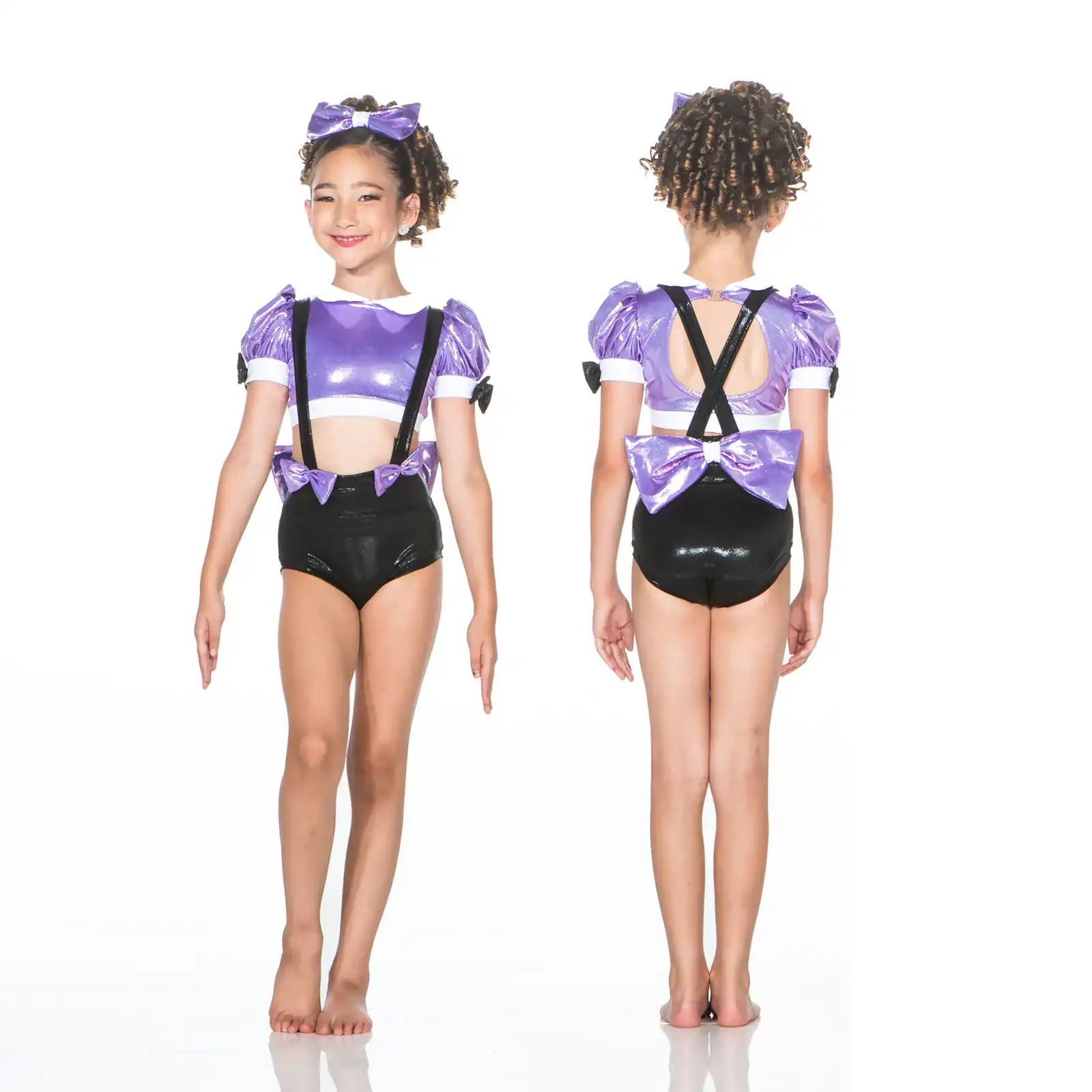 Girl modeling purple and black dance costume, front and back