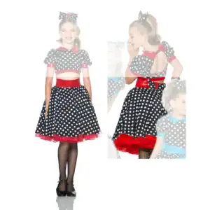 Girl modeling black polka-dot dress with red accents