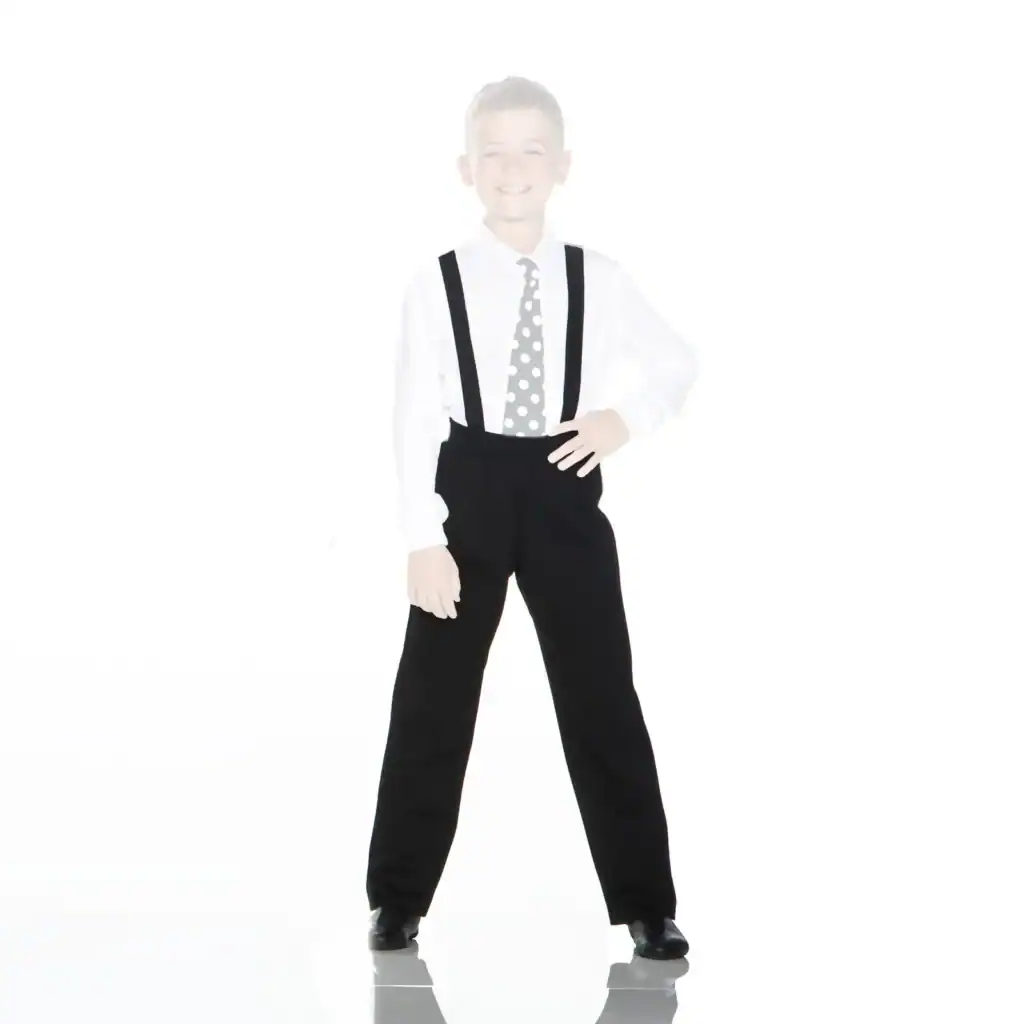 Smiling boy wearing suspenders and polka-dot tie