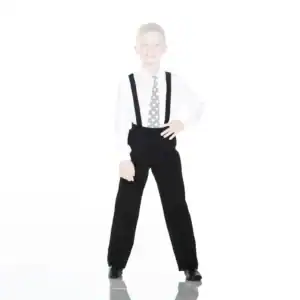 Smiling boy wearing suspenders and polka-dot tie