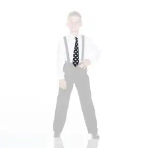 Smiling boy in suspenders wearing a black polka-dot tie