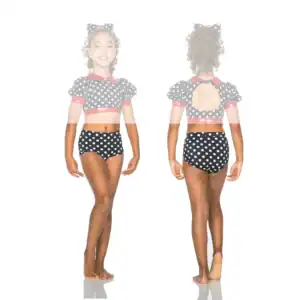 Girl modeling black polka-dot dance outfit, front and back views