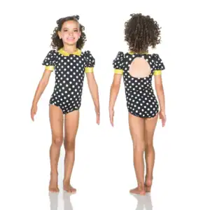 Girl modeling black polka-dot leotard, front and back views