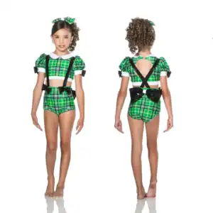 Girl modeling green plaid dance costume, front and back views