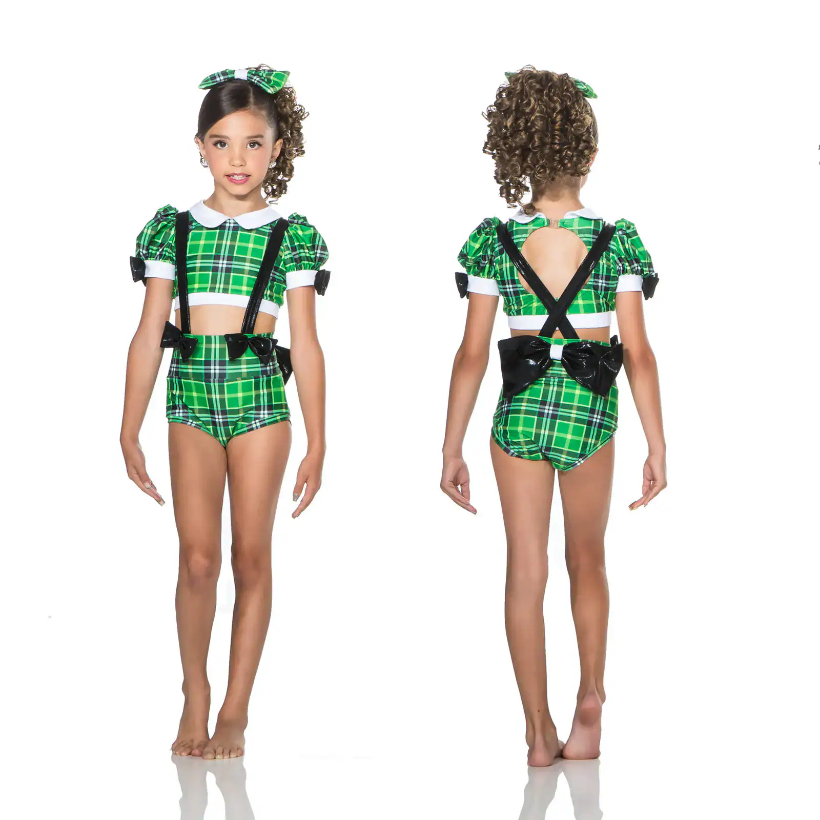 Girl modeling green plaid dance costume, front and back views
