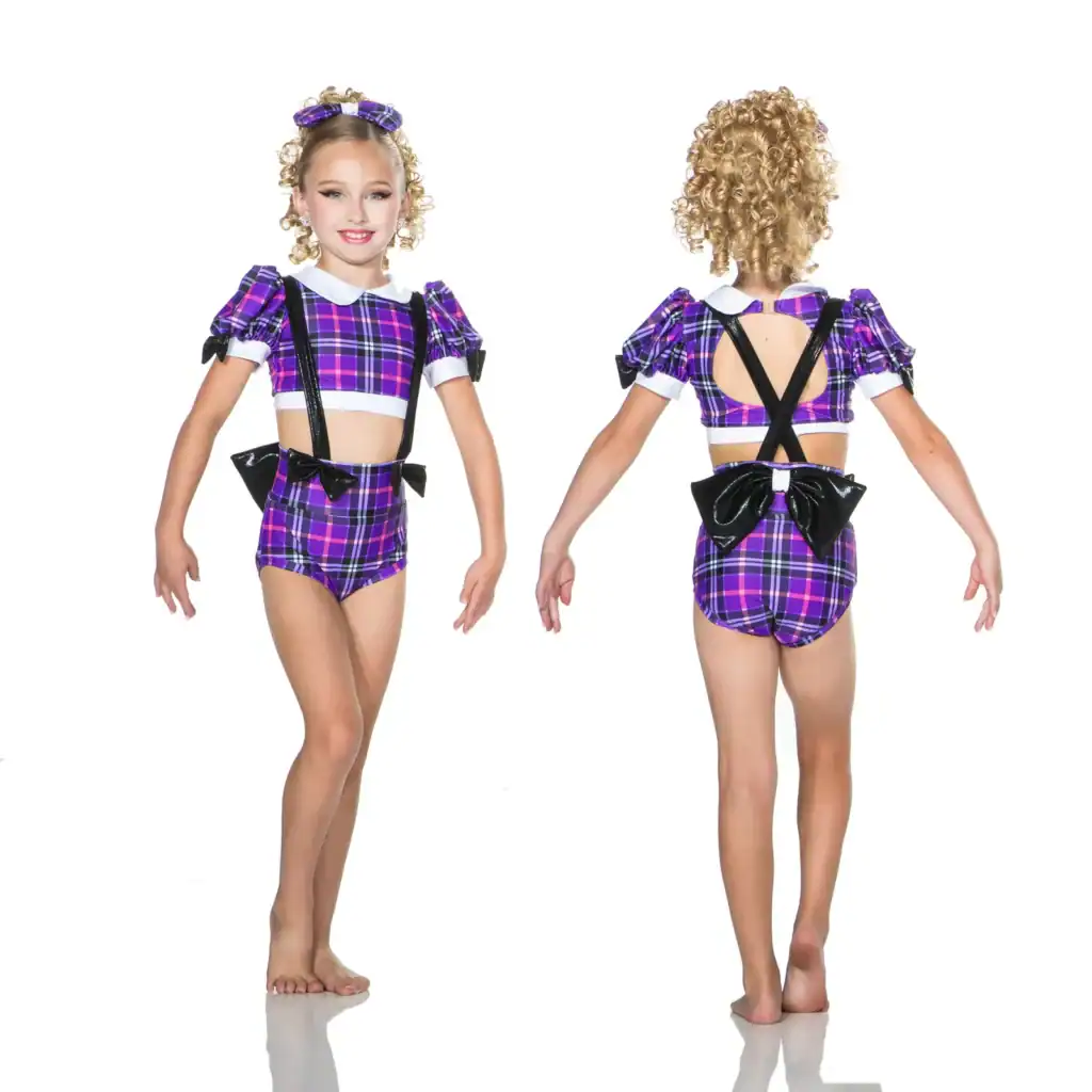 Girl modeling purple plaid dance costume, front and back views