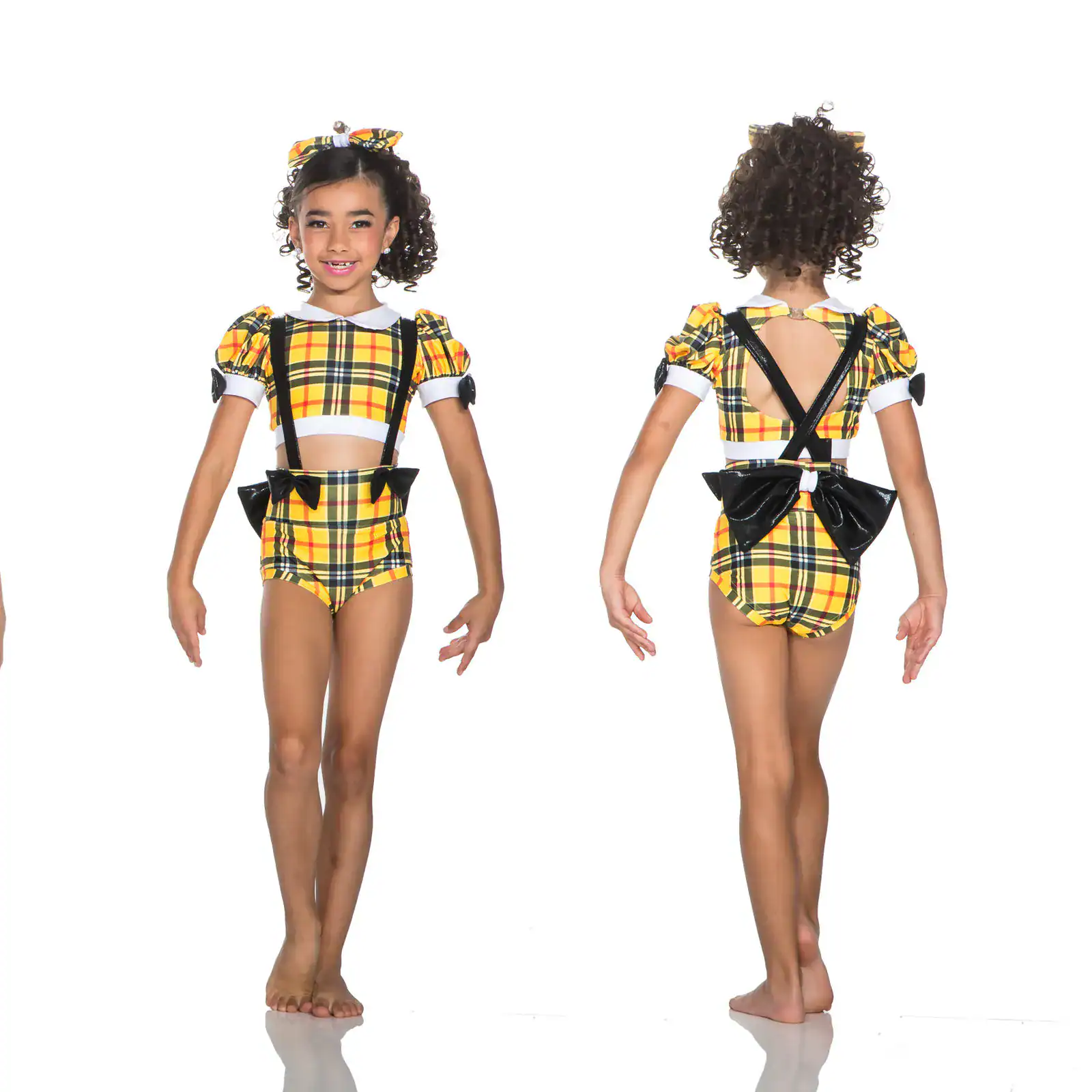 Girl modeling yellow plaid dance costume, front and back views