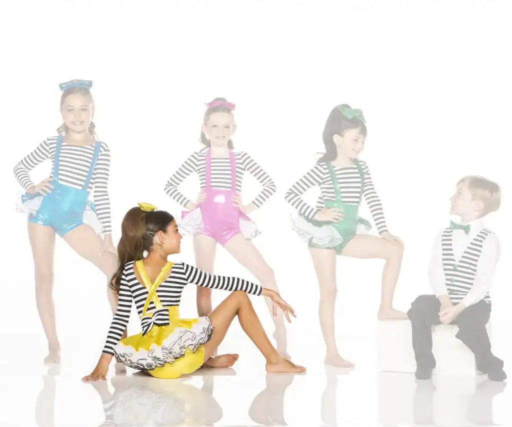 Five children in colorful striped dance costumes posing