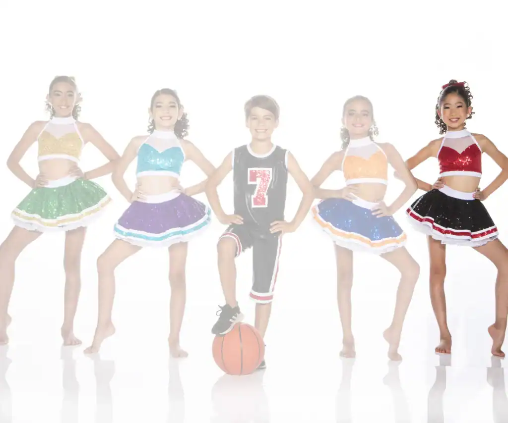 Five children in glittery dance costumes, boy holding basketball