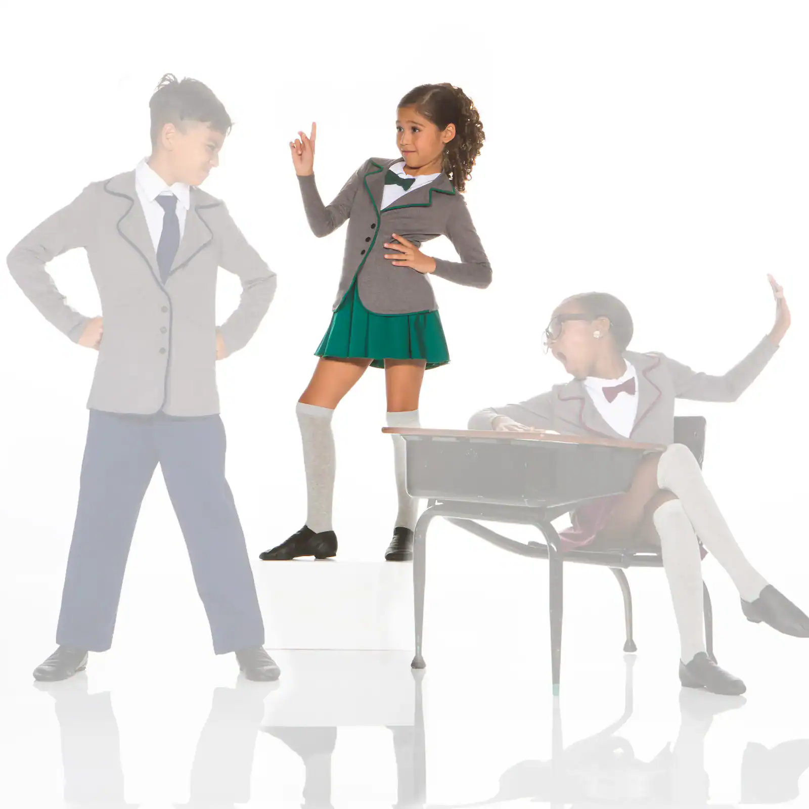 Three children in school uniforms posing dramatically on white background.