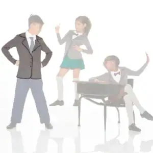 Three children in school uniforms posing around a classroom desk.