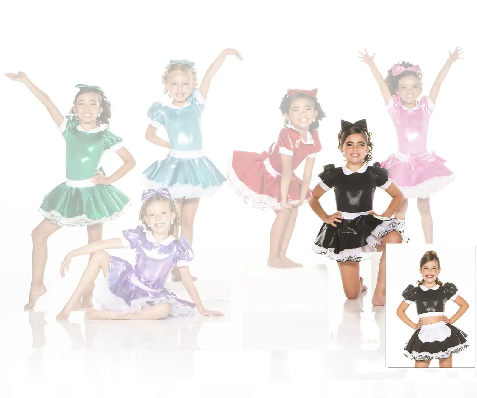 Young dancers in colorful shiny costumes posing together.