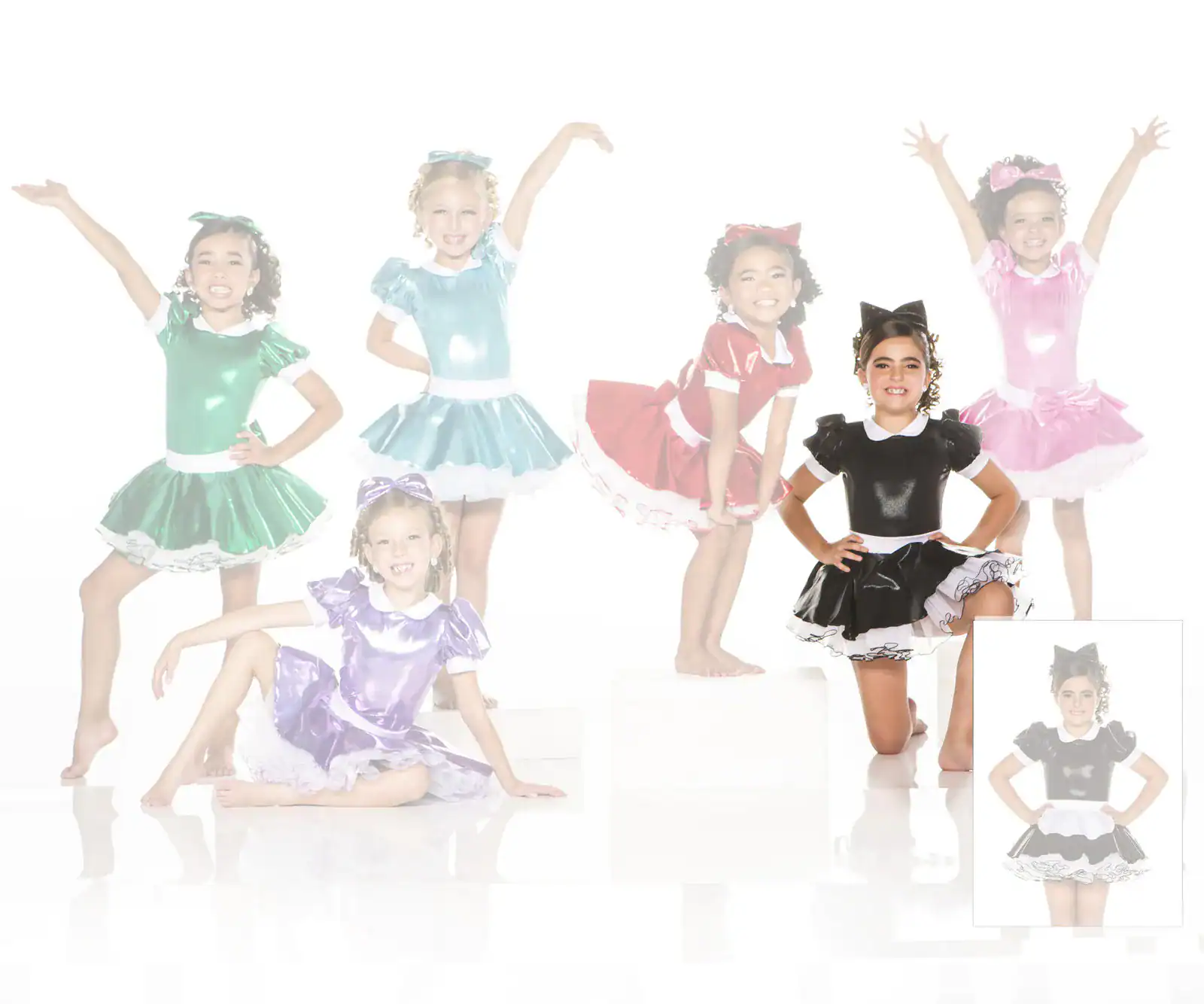 Girls modeling colorful shiny dance costumes on white background