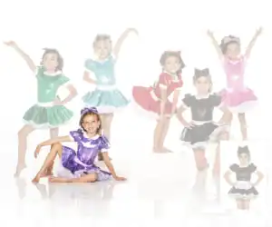 Girls wearing colorful shiny dance costumes posing in studio