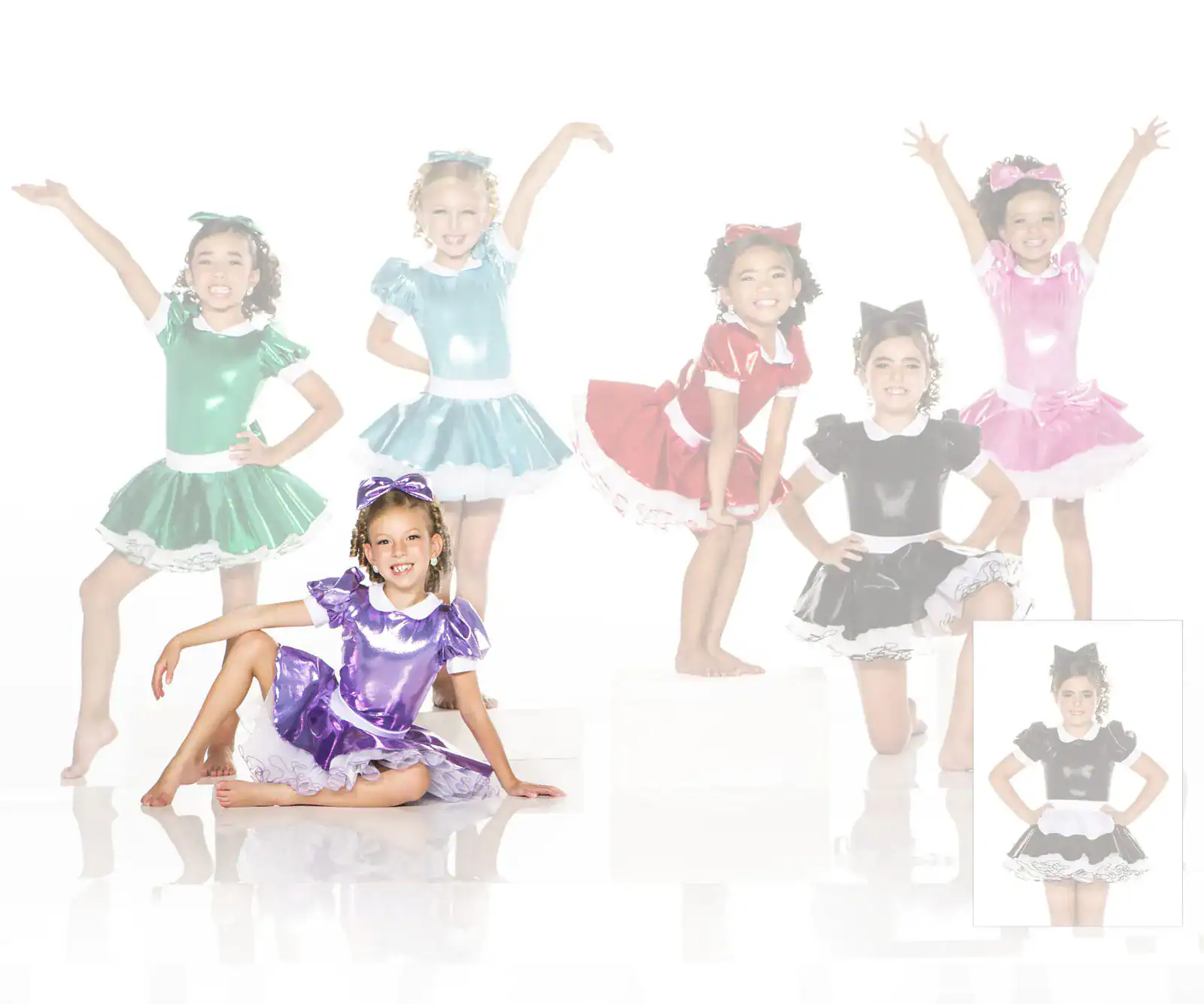 Girls wearing colorful shiny dance costumes posing in studio