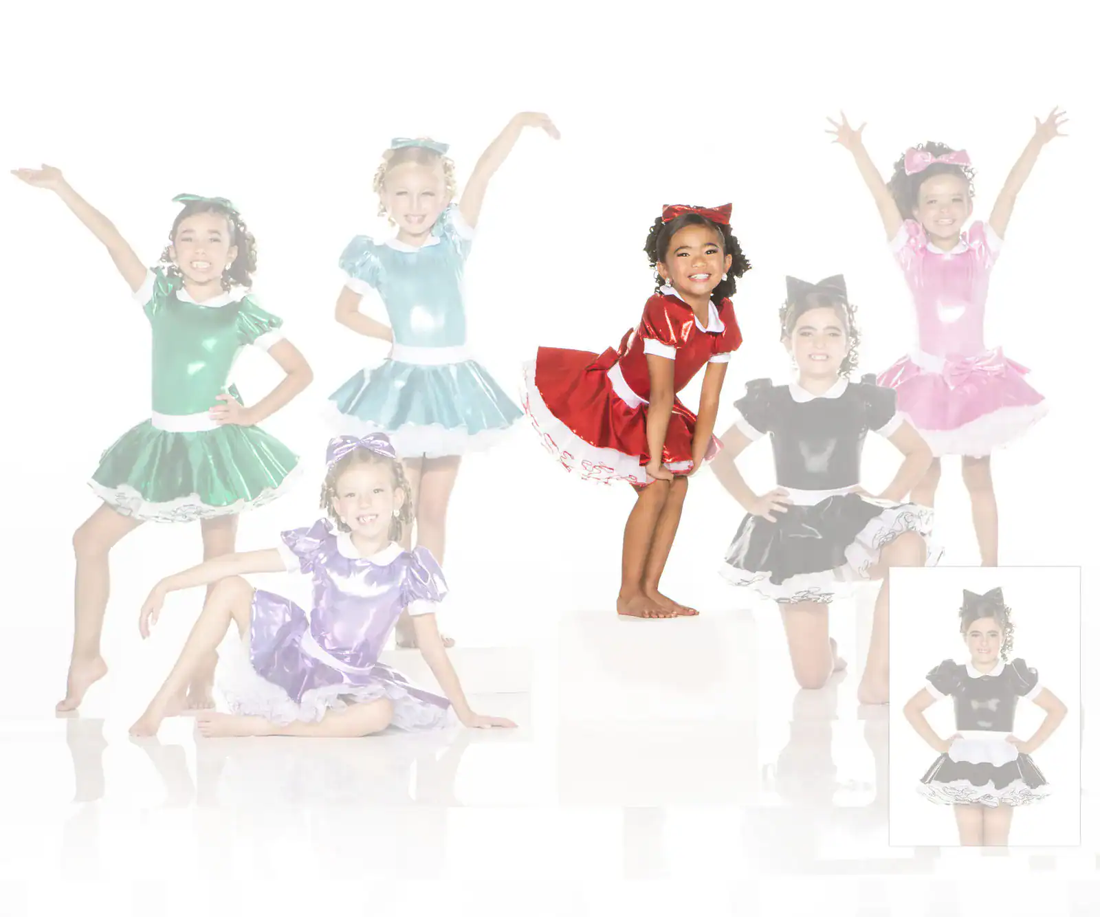 Young girls modeling colorful satin dance costumes
