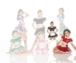 Girls modeling colorful shiny dance costumes on white background