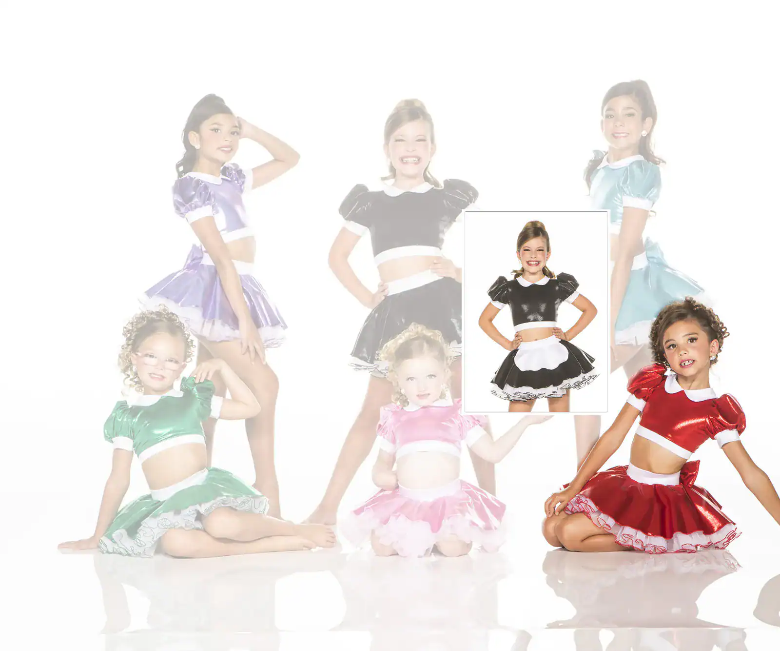Girls modeling colorful shiny dance costumes on white background