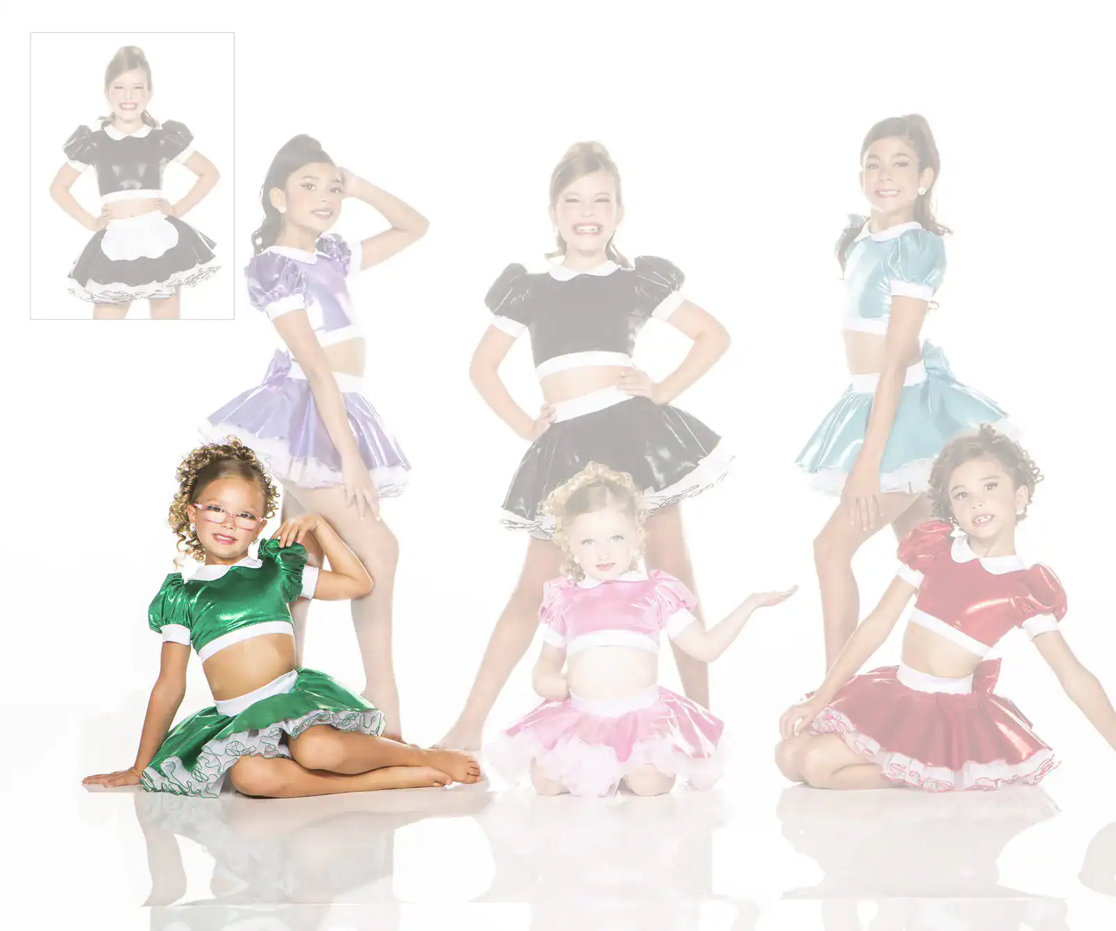 Young dancers wearing colorful shiny costumes pose together.