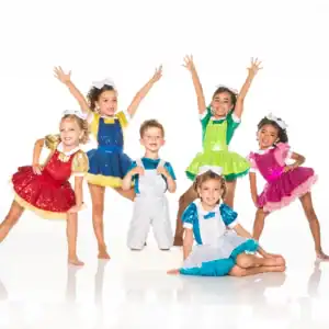 Six children posing in colorful sequined dance costumes