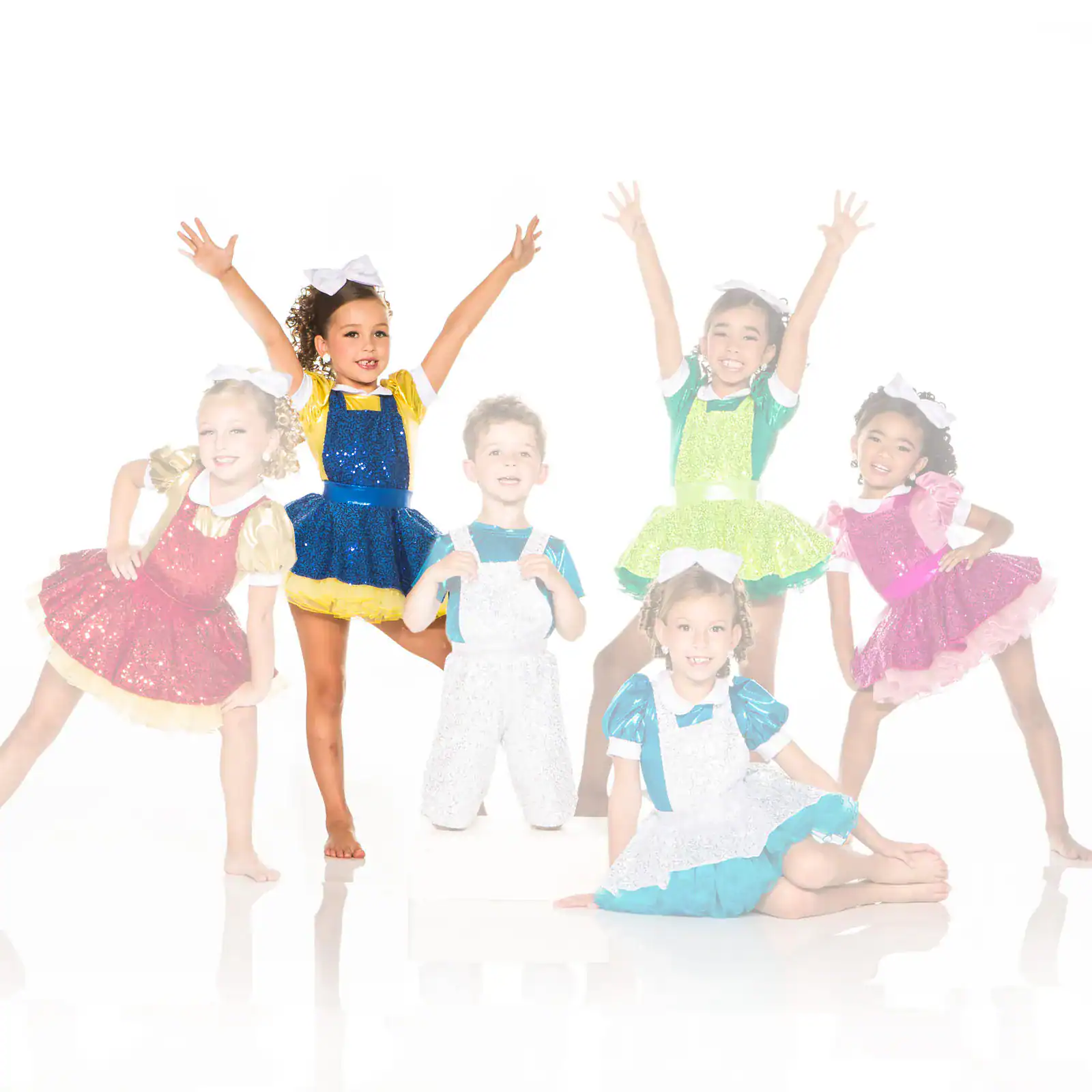 Six children posing in colorful sparkling dance costumes