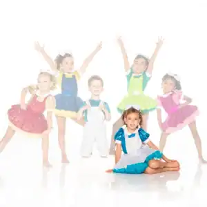 Six children in colorful sequined dance costumes posing