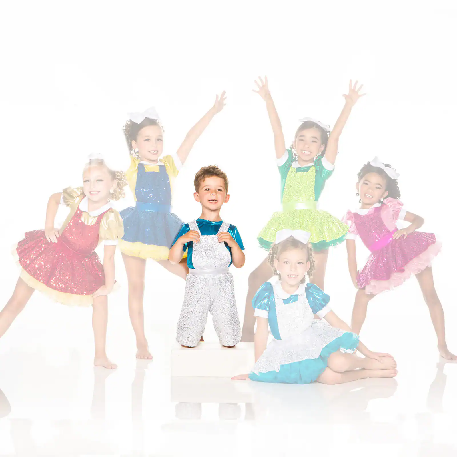 Children posing in colorful sparkling dance costumes