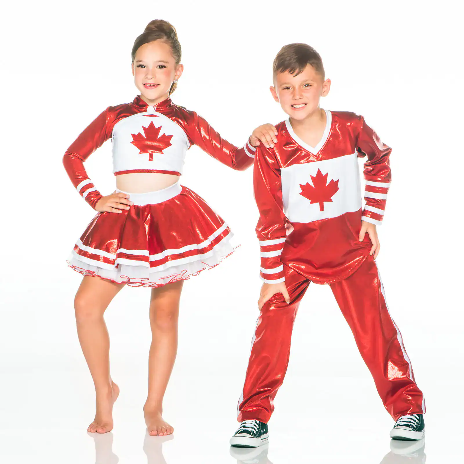 Two children wearing red Canadian maple leaf costumes