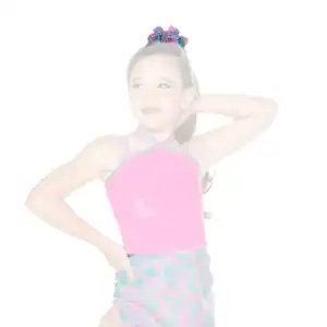 Young girl posing in pink dance costume with hair bow