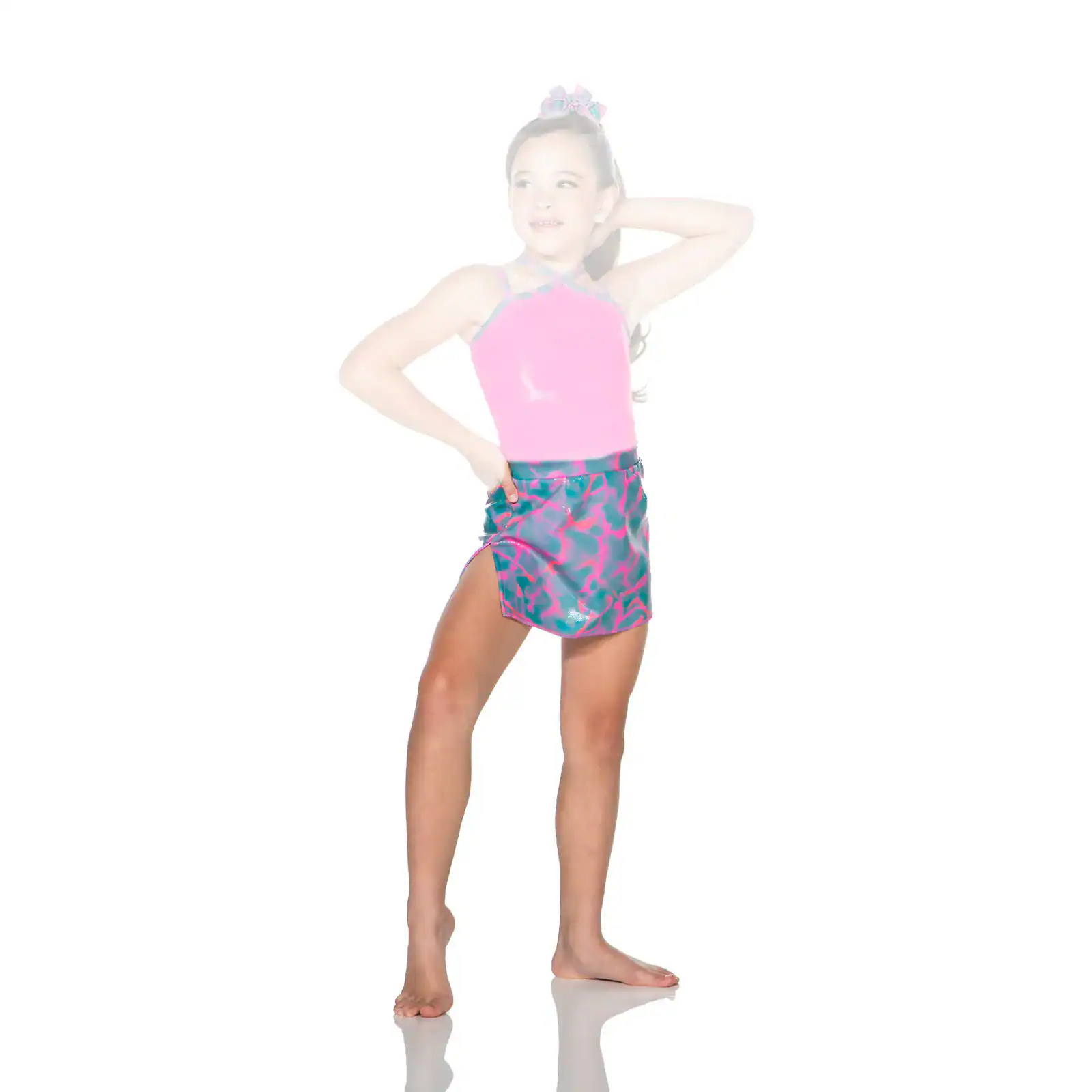 Girl wearing pink dance outfit with patterned skirt