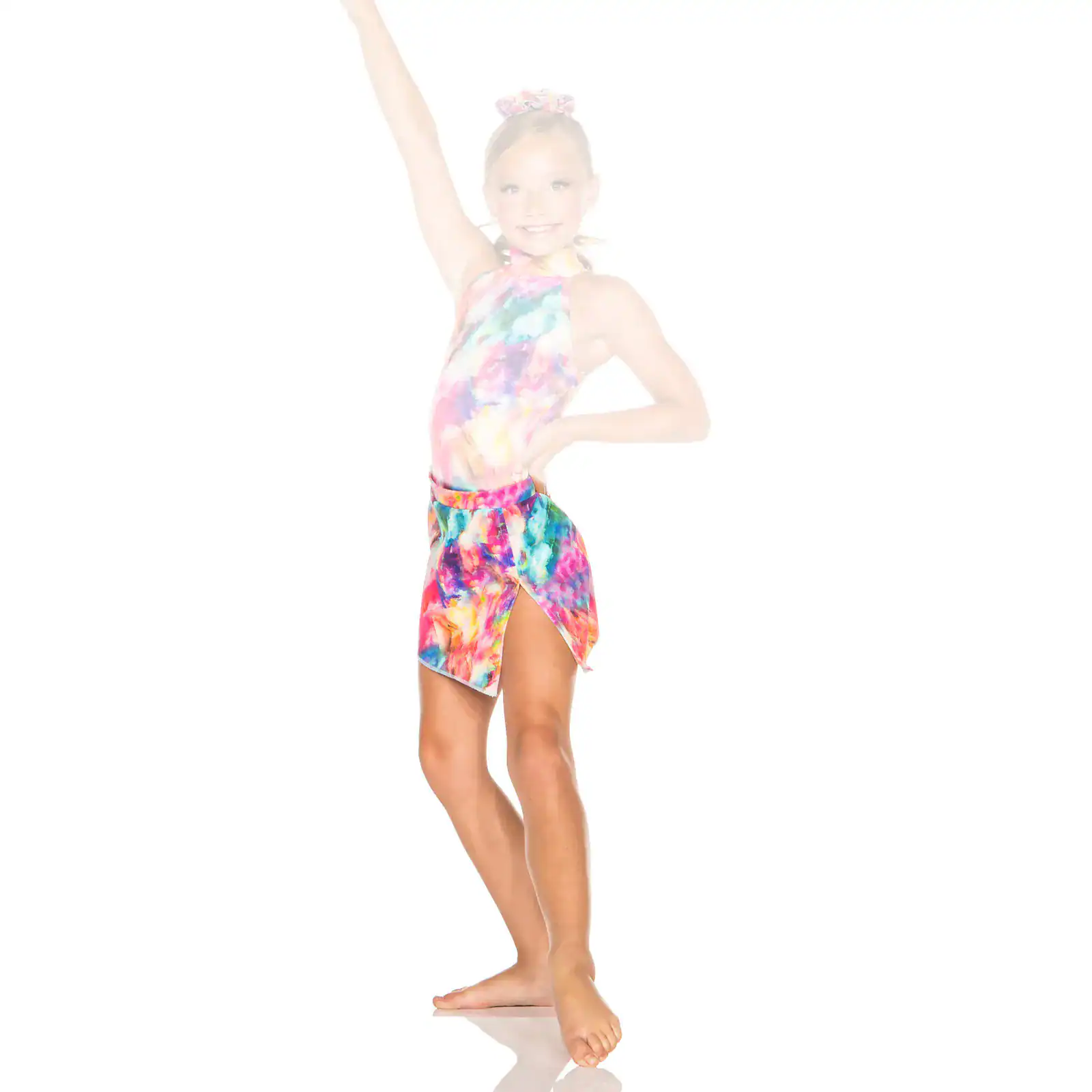 Young dancer posing in colorful tie-dye costume