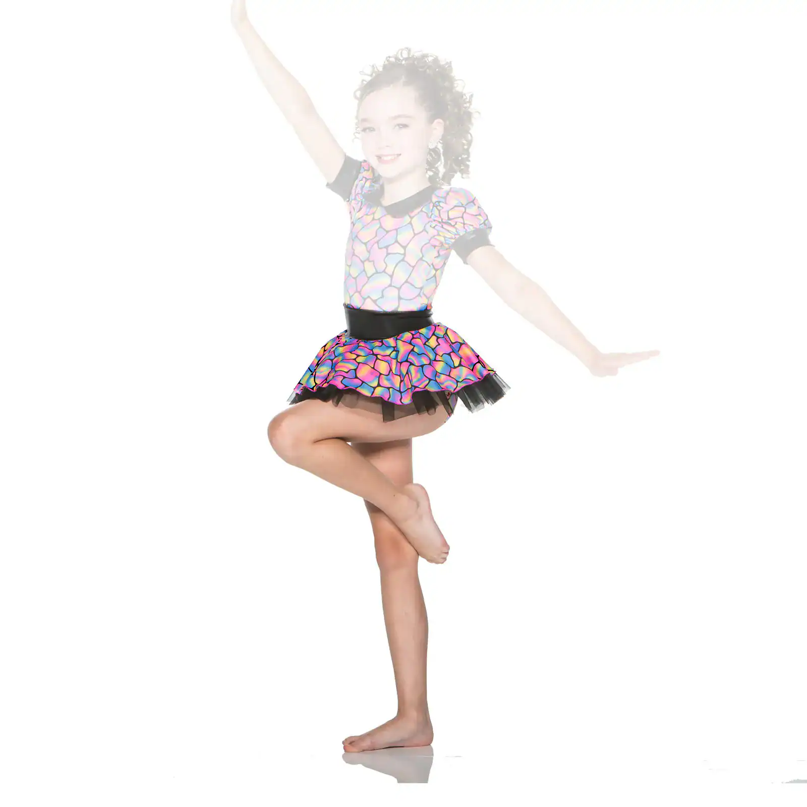 Young dancer balancing in a colorful patterned costume
