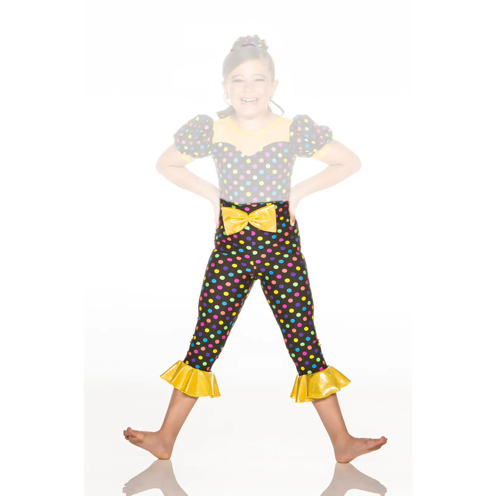 Smiling girl in colorful polka-dot dance costume