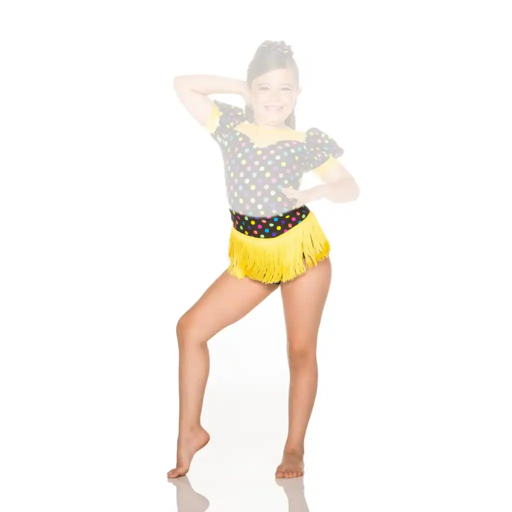 Young dancer posing in colorful polka-dot costume with yellow fringe