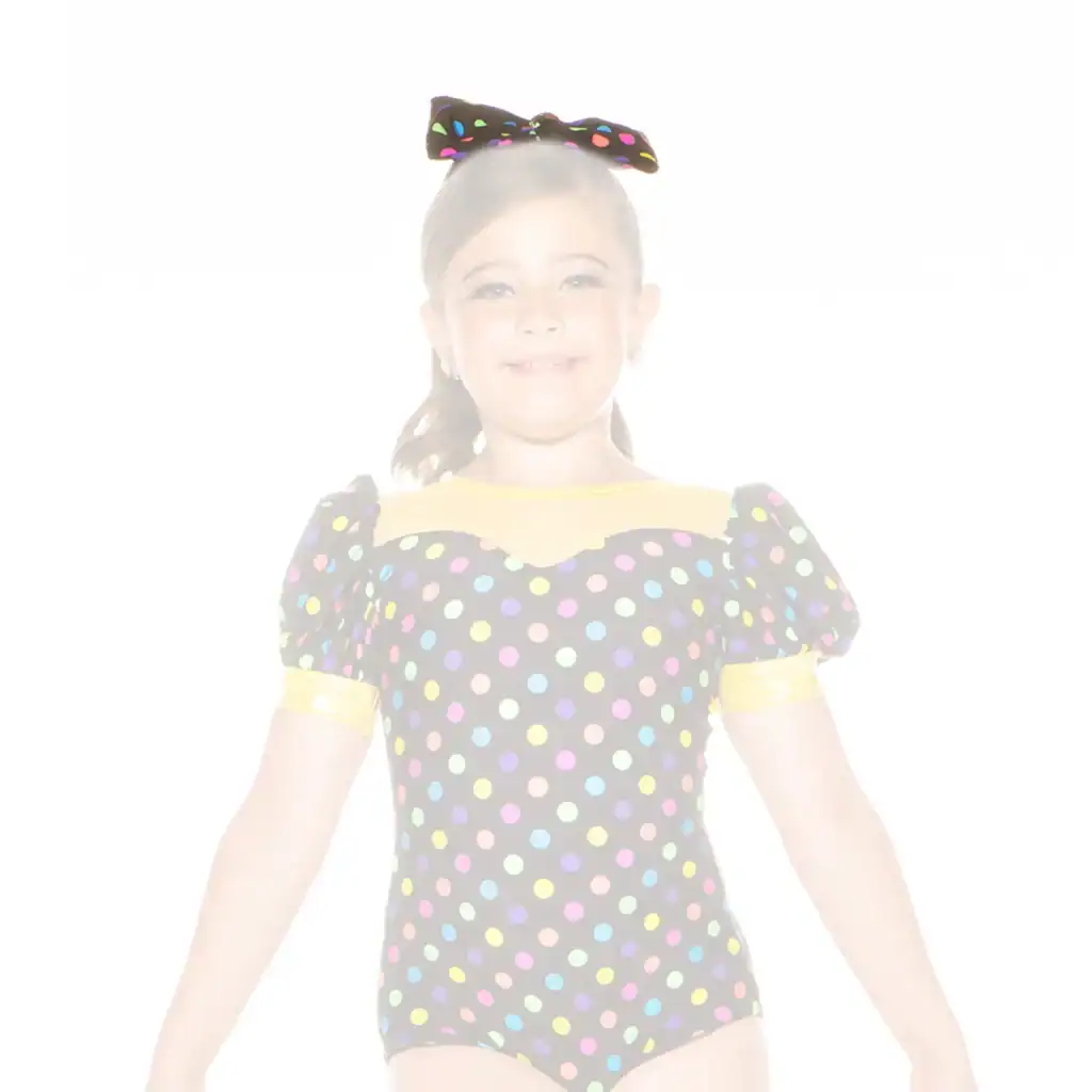 Young girl in colorful polka-dot dance costume and bow