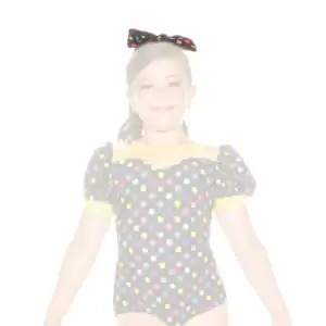 Young girl in colorful polka-dot dance costume and bow