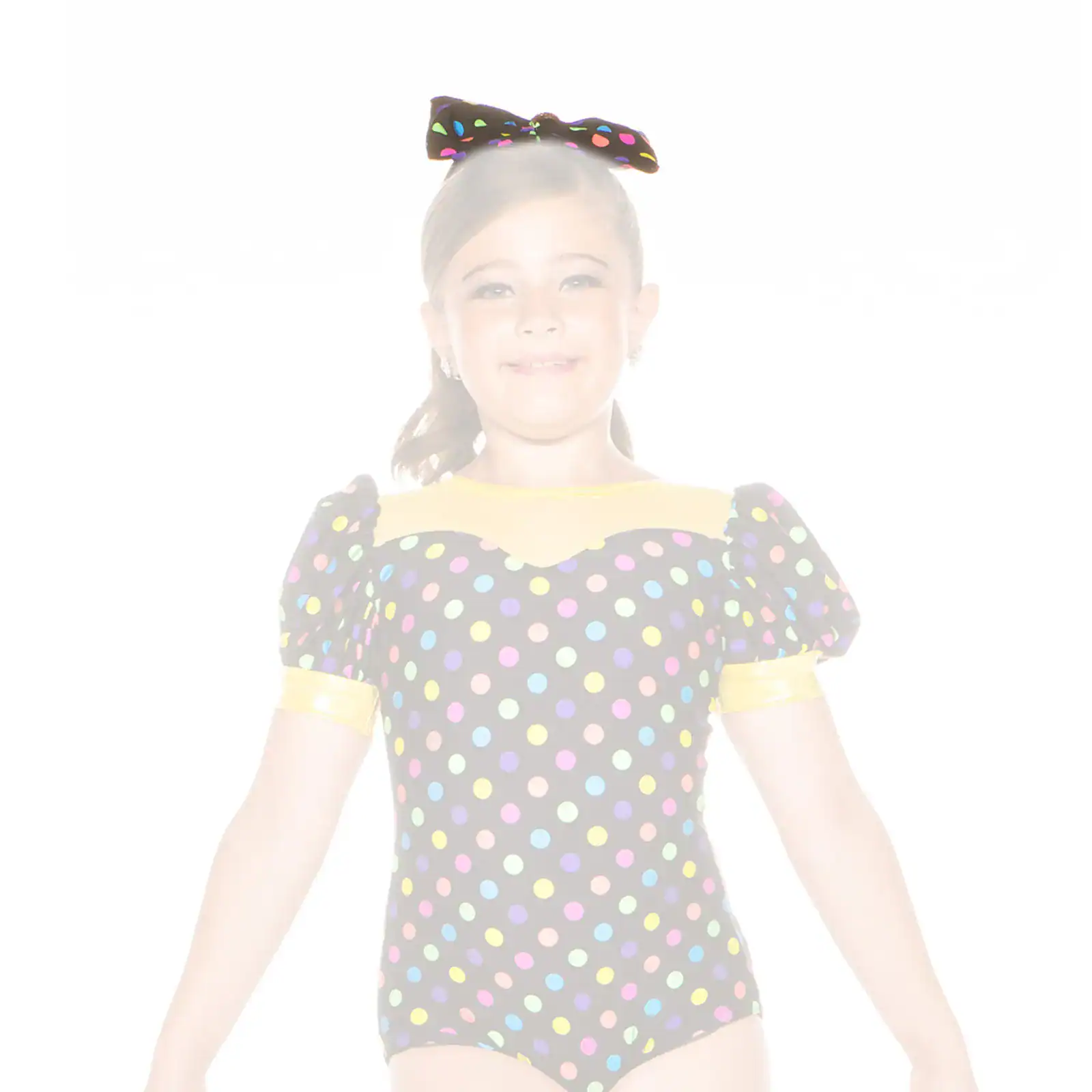 Young girl in colorful polka-dot dance costume and bow