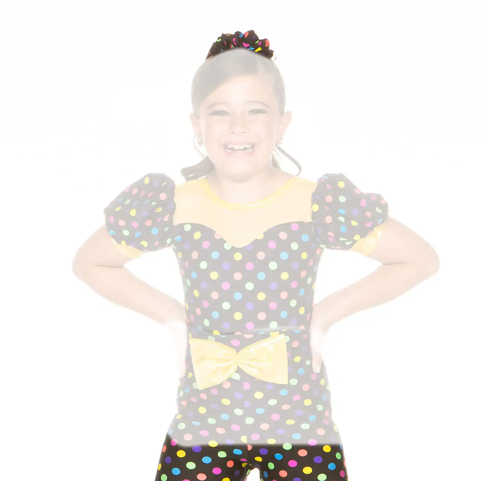 Smiling girl in colorful polka-dot dance costume